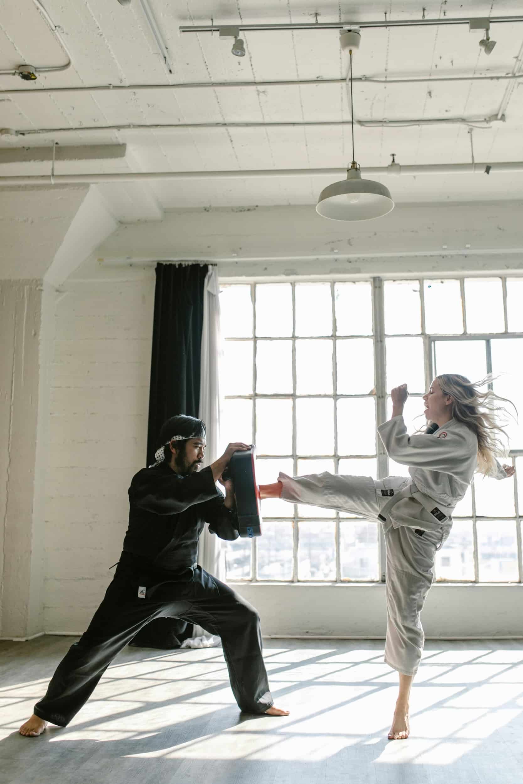 Adult Moores Martial Arts Academy student demonstrating proper kicking techniques